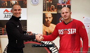 JuatBounce Founder Remy Draaijer, presents a bellicon trampoline to Russian MMA legend Fedor Emelianenko.